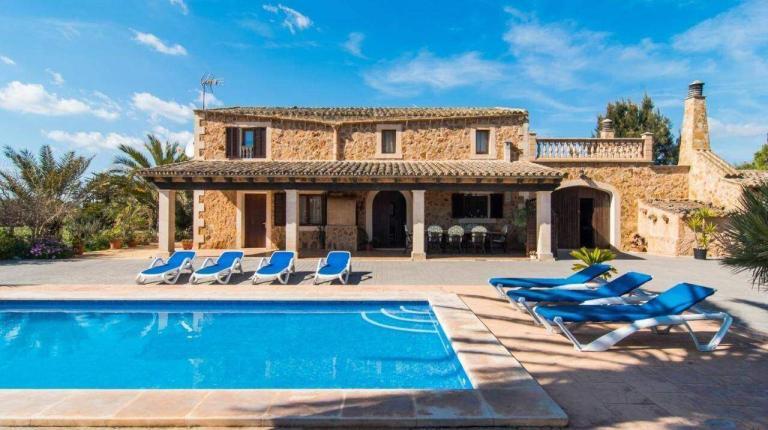 A Pool In Front Of A House