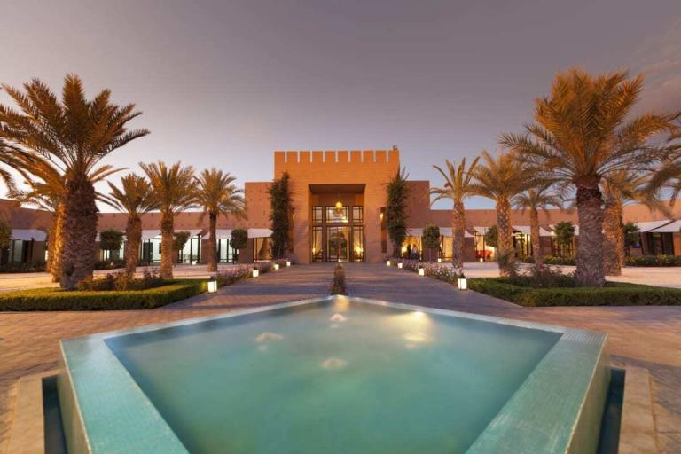 A Pool In Front Of A Building