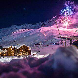 Fireworks In The Sky Over A Snowy Mountain