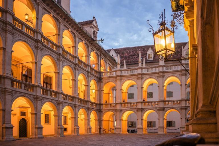 A Building With Many Arches And A Street Light