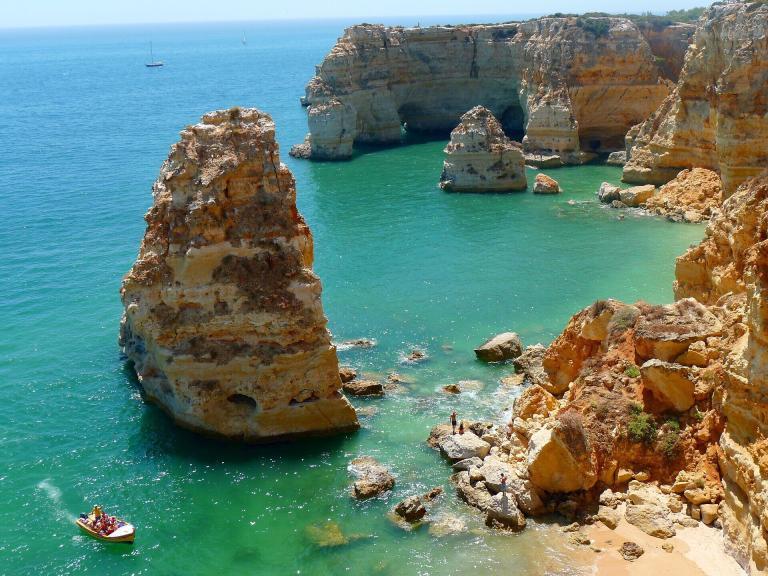 A Rocky Cliffs In The Water